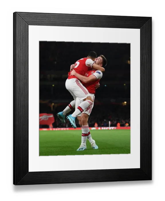 Framed Print : Arsenal's Martinelli and Tierney Celebrate First Goal vs. Standard Liege in Europa League (2019-20) Framed Print : Arsenal's Martinelli and Tierney Celebrate First Goal vs. Standard Liege in Europa League (2019-20)
