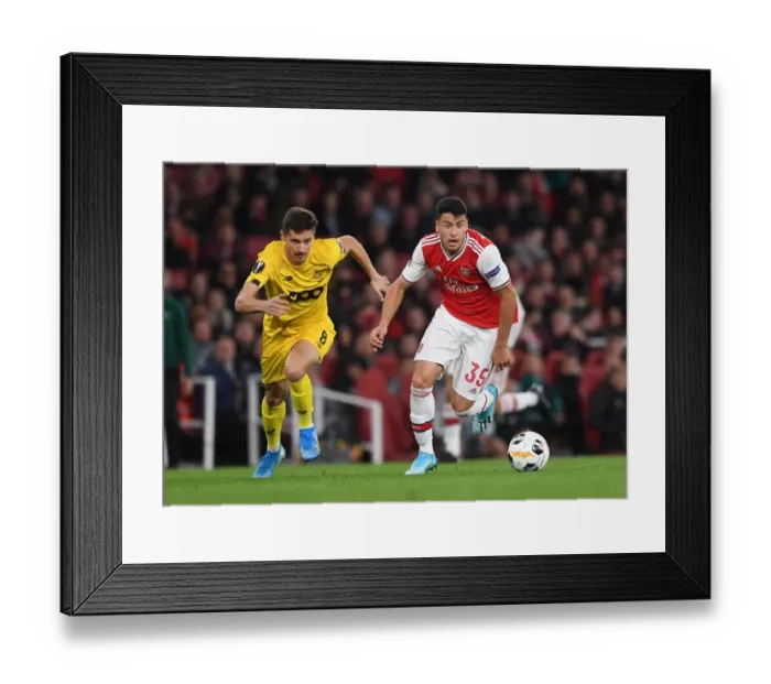 Framed Print : Martinelli vs. Cimirot: Intense Face-Off in Arsenal's Europa League Battle