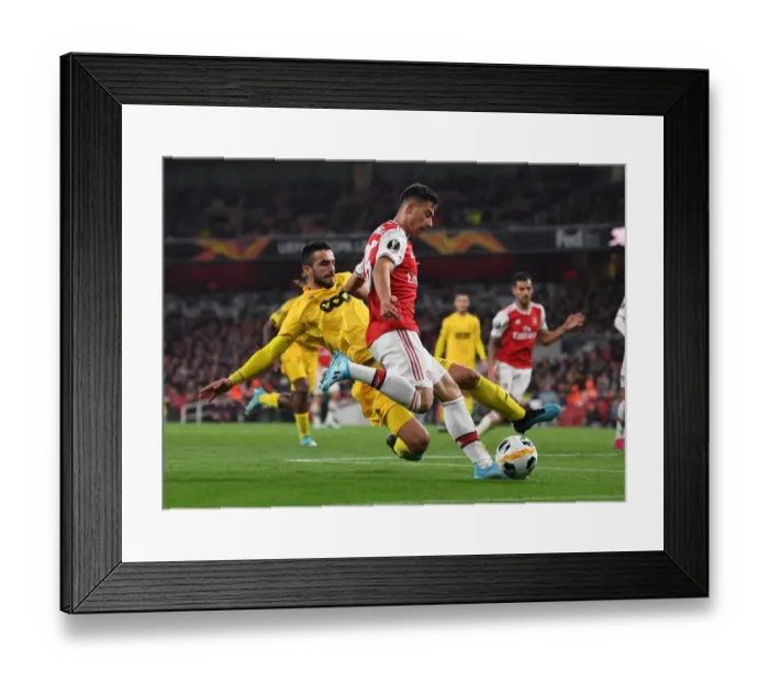 Framed Print : Arsenal's Martinelli Clashes with Standard Liege's Laifis in Europa League Showdown Framed Print : Arsenal's Martinelli Clashes with Standard Liege's Laifis in Europa League Showdown