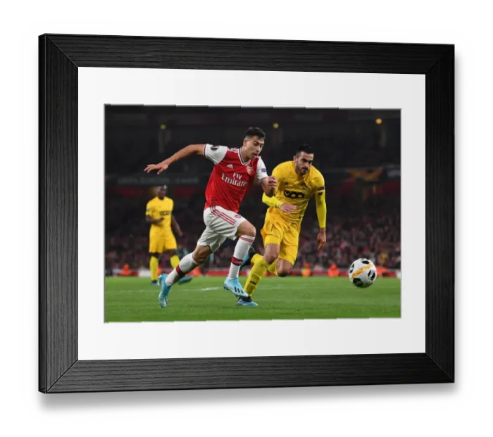 Framed Print : Martinelli vs. Laifis: Arsenal's Battle Against Standard Liege in Europa League Framed Print : Martinelli vs. Laifis: Arsenal's Battle Against Standard Liege in Europa League