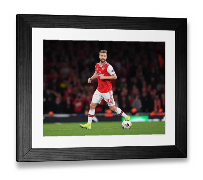 Framed Print : Arsenal's Mustafi in Action against Standard Liege in Europa League Match
