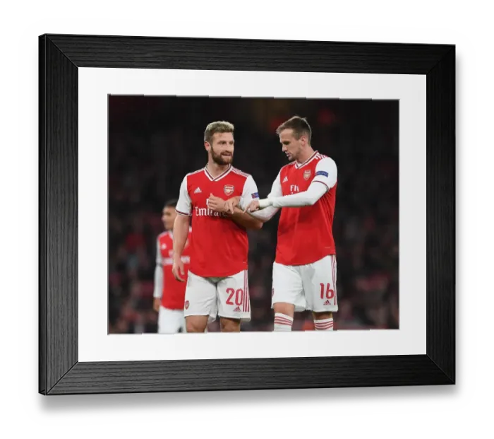 Framed Print : Arsenal's Mustafi and Holding in Action against Standard Liege in Europa League Framed Print : Arsenal's Mustafi and Holding in Action against Standard Liege in Europa League