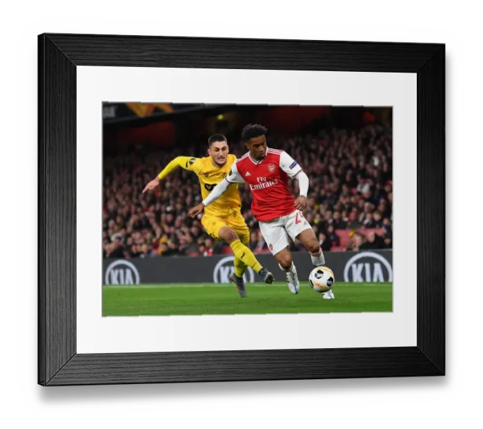 Framed Print : Arsenal vs Standard Liege: Nelson vs Beljevic in Europa League Clash at Emirates Stadium