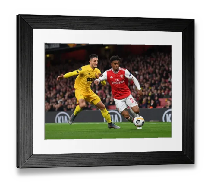 Framed Print : Arsenal's Nelson vs. Boljevic: A Europa League Battle at Emirates Stadium Framed Print : Arsenal's Nelson vs. Boljevic: A Europa League Battle at Emirates Stadium
