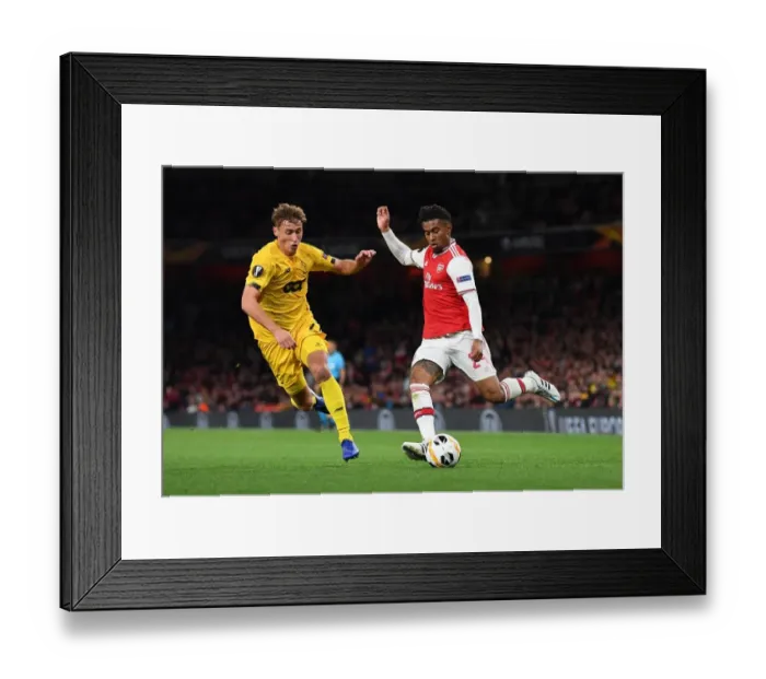 Framed Print : Arsenal's Nelson vs Vojvoda: A Europa League Battle at Emirates Stadium