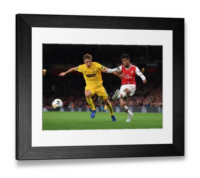 Framed Print : Arsenal vs Standard Liege: Nelson vs Vojvoda in Europa League Clash at Emirates Stadium
