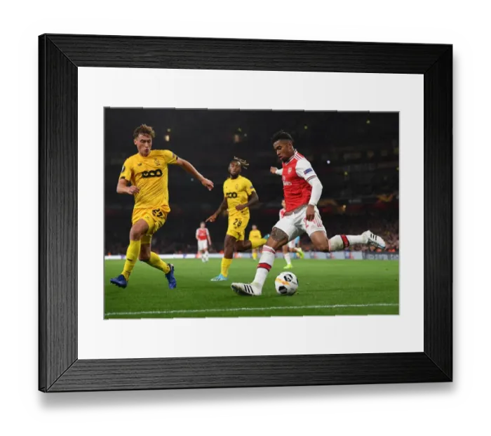 Framed Print : Arsenal's Reiss Nelson Goes Head-to-Head with Mergim Vojvoda in Europa League Showdown Framed Print : Arsenal's Reiss Nelson Goes Head-to-Head with Mergim Vojvoda in Europa League Showdown