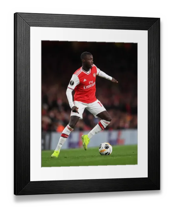 Framed Print : Nicolas Pepe Shines: Arsenal's Europa League Triumph over Standard Liege Framed Print : Nicolas Pepe Shines: Arsenal's Europa League Triumph over Standard Liege
