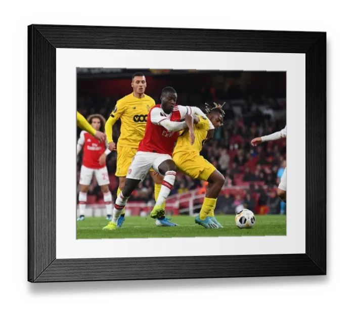 Framed Print : Pepe vs Bastien: Intense Clash in Arsenal's Europa League Match against Standard Liege Framed Print : Pepe vs Bastien: Intense Clash in Arsenal's Europa League Match against Standard Liege