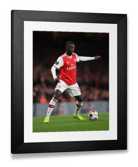 Framed Print : Arsenal's Nicolas Pepe in Action against Standard Liege in Europa League Group Stage, Emirates Stadium, London, 2019 Framed Print : Arsenal's Nicolas Pepe in Action against Standard Liege in Europa League Group Stage, Emirates Stadium, London, 2019