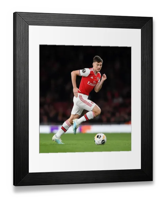 Framed Print : Arsenal's Kieran Tierney in Action during Europa League Match vs Standard Liege