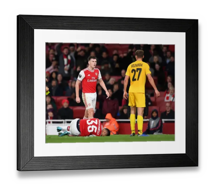 Framed Print : Arsenal vs Standard Liege: Tierney and Vojvoda Clash in Europa League Group F