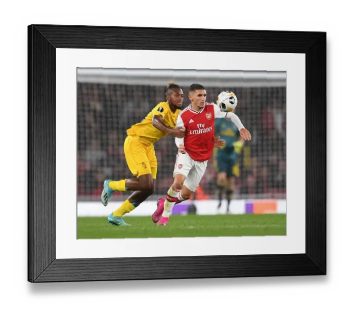 Framed Print : Arsenal's Torreira Faces Off Against Standard Liege's Bastien in Europa League Clash Framed Print : Arsenal's Torreira Faces Off Against Standard Liege's Bastien in Europa League Clash