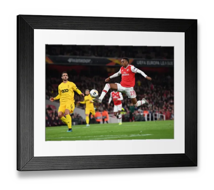 Framed Print : Joe Willock's Star Performance: Arsenal Overpowers Standard Liege in Europa League Framed Print : Joe Willock's Star Performance: Arsenal Overpowers Standard Liege in Europa League