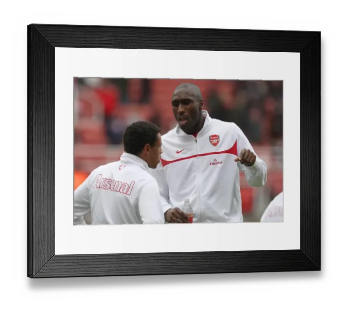 Framed Print : Sol Campbell Counsels Coquelin Before the Storm: Arsenal's FA Cup Battle at Stoke City