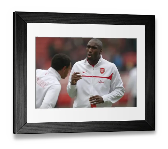 Framed Print : Sol Campbell talks to Francis Coquelin (Arsenal) before the match. Stoke City 3: 1 Arsenal