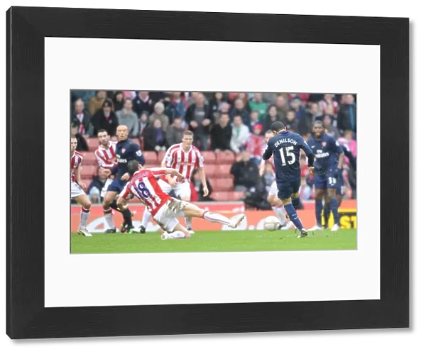 Denilson shoots past Dean Whitehead to score the Arsenal goal. Stoke City 3: 1 Arsenal