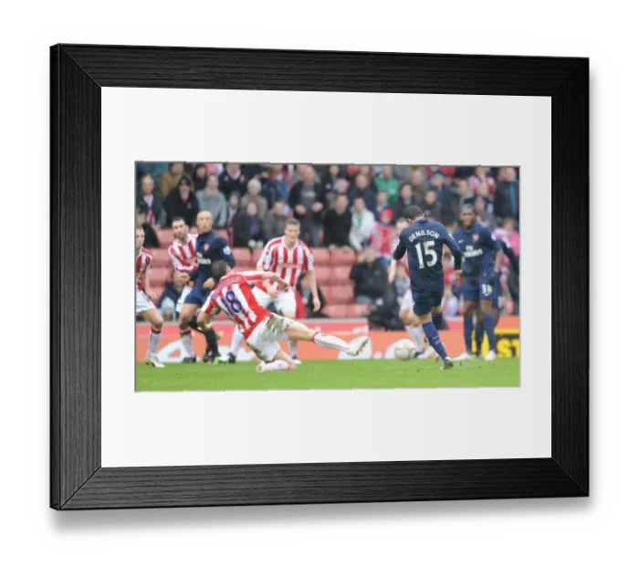 Framed Print : Denilson shoots past Dean Whitehead to score the Arsenal goal. Stoke City 3: 1 Arsenal Framed Print : Denilson shoots past Dean Whitehead to score the Arsenal goal. Stoke City 3: 1 Arsenal