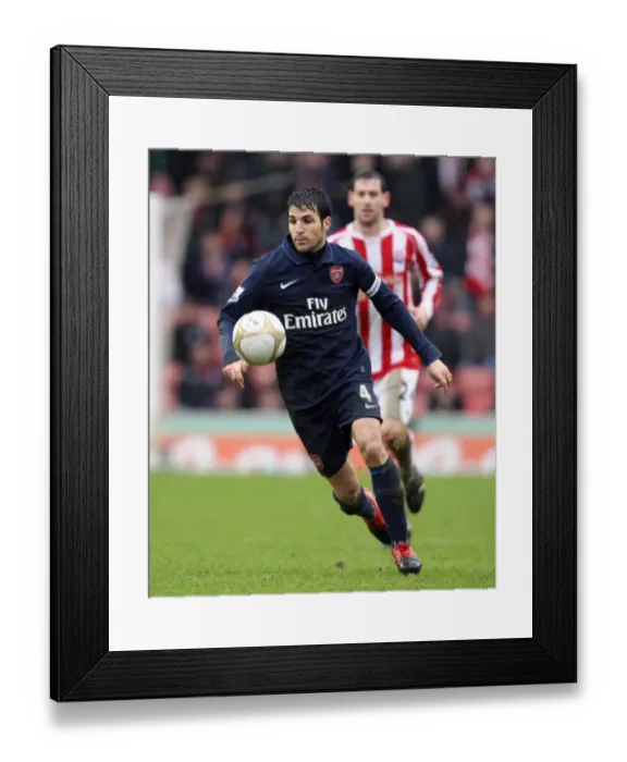 Framed Print : Cesc Fabregas's FA Cup Struggle: Arsenal vs. Stoke City 3-1 at The Britannia Stadium, January 2010