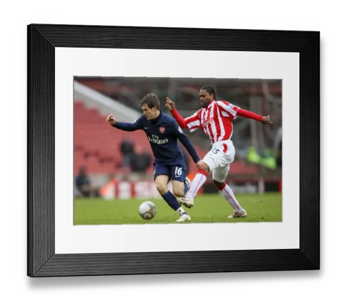 Framed Print : Ramsey vs. Diao: Stoke's Upset Over Arsenal in FA Cup 4th Round