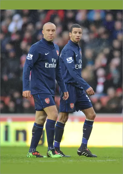 Mikael Silvestre and Craig Eastmond (Arsenal). Stoke City 3: 1 Arsenal, FA Cup 4th round