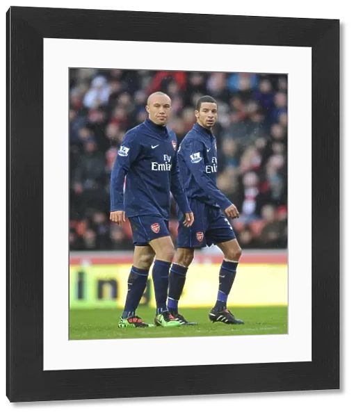 Mikael Silvestre and Craig Eastmond (Arsenal). Stoke City 3: 1 Arsenal, FA Cup 4th round