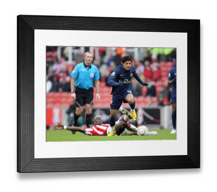 Framed Print : Carlos Vela (Arsenal) Mamady Sidibe (Stoke). Stoke City 3: 1 Arsenal. FA Cup 4th Round Framed Print : Carlos Vela (Arsenal) Mamady Sidibe (Stoke). Stoke City 3: 1 Arsenal. FA Cup 4th Round