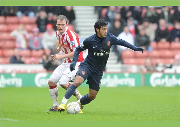Carlos Vela (Arsenal) Glenn Whelan (Stoke). Stoke City 3: 1 Arsenal, FA Cup 4th round