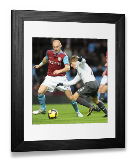 Framed Print : Andrey Arshavin (Arsenal) James Collins (Villa). Aston Villa 0: 0 Arsenal Framed Print : Andrey Arshavin (Arsenal) James Collins (Villa). Aston Villa 0: 0 Arsenal