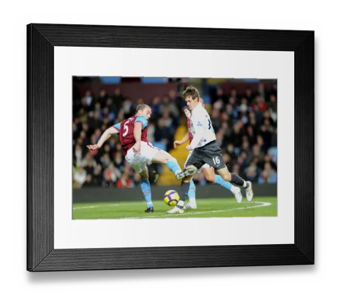 Framed Print : Aaron Ramsey (Arsenal) Richard Dunne (Villa). Aston Villa 0: 0 Arsenal. Barclays Premier League