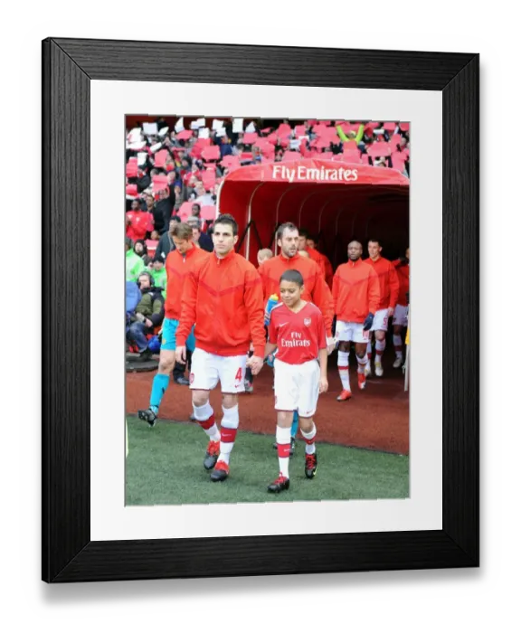Framed Print : Arsenal captain Cesc Fabregas leads the team out before the match. Arsenal 1 Framed Print : Arsenal captain Cesc Fabregas leads the team out before the match. Arsenal 1
