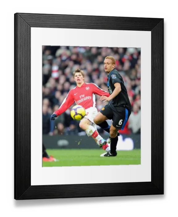 Framed Print : Arsenal's Struggle Against Manchester United: Arshavin vs. Brown (31 / 10 / 2010)