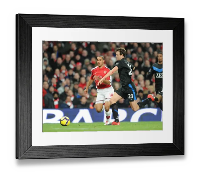 Framed Print : Theo Walcott (Arsenal) Jonny Evans (Man United). Arsenal 1: 3 Manchester United Framed Print : Theo Walcott (Arsenal) Jonny Evans (Man United). Arsenal 1: 3 Manchester United
