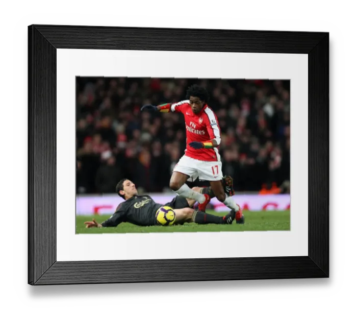 Framed Print : Alex Song (Arsenal) Maxi Rodriguez (Liverpool). Arsenal 1: 0 Liverpool. Barclays Premier League