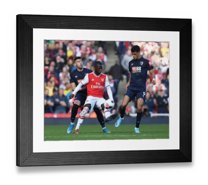 Framed Print : Arsenal's Pepe Outmaneuvers Bournemouth's Solanke in Premier League Clash Framed Print : Arsenal's Pepe Outmaneuvers Bournemouth's Solanke in Premier League Clash