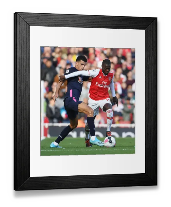 Framed Print : Pepe's Sneaky Moves: Outsmarting Solanke in Arsenal's Premier League Victory Framed Print : Pepe's Sneaky Moves: Outsmarting Solanke in Arsenal's Premier League Victory