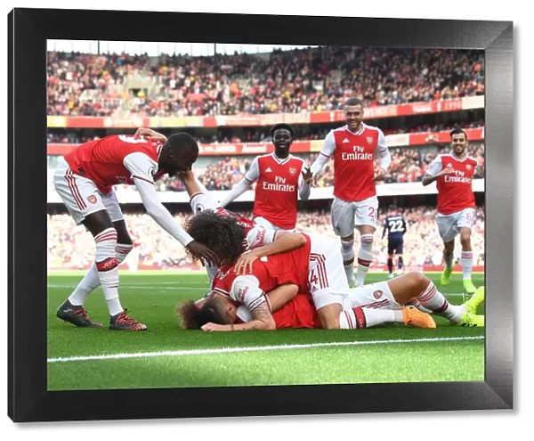 Arsenal's David Luiz Scores and Celebrates with Teammates against AFC Bournemouth (2019-20)