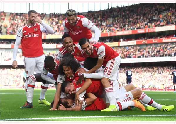 Arsenal's David Luiz Scores and Celebrates with Team against AFC Bournemouth in 2019-20 Premier League