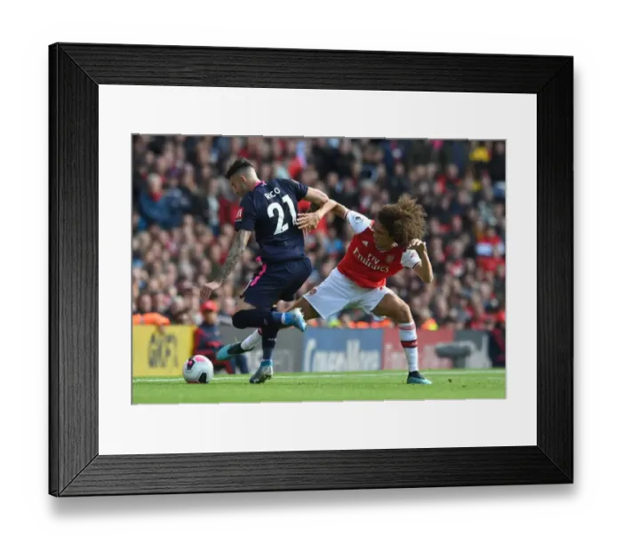 Framed Print : Arsenal vs. AFC Bournemouth: Matteo Guendouzi Tackles Diego Rico in Premier League Clash Framed Print : Arsenal vs. AFC Bournemouth: Matteo Guendouzi Tackles Diego Rico in Premier League Clash