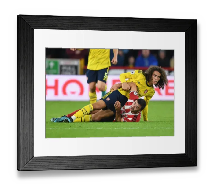 Framed Print : Guendouzi vs. Stevens: Intense Clash in Sheffield United vs. Arsenal Premier League Match Framed Print : Guendouzi vs. Stevens: Intense Clash in Sheffield United vs. Arsenal Premier League Match