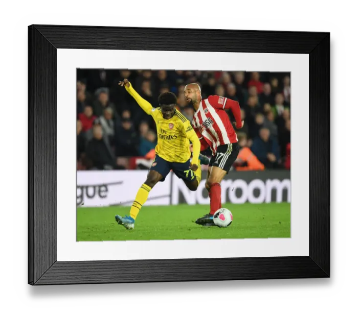 Framed Print : Saka vs. McGoldrick: A Premier League Showdown - Sheffield United vs. Arsenal