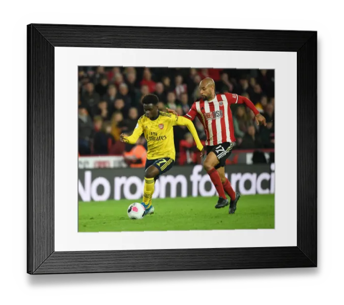 Framed Print : Bukayo Saka vs. David McGoldrick: Clash at Bramall Lane - Sheffield United vs. Arsenal, Premier League 2019-20