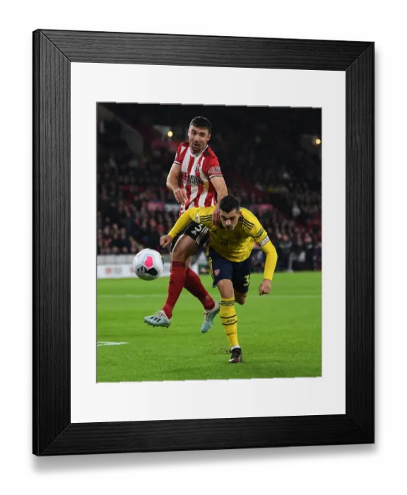 Framed Print : Xhaka vs Stevens: Intense Battle in Sheffield United vs Arsenal Premier League Clash