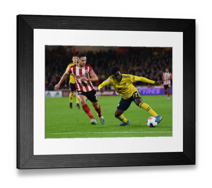 Framed Print : Saka vs Baldock: Battle at Bramall Lane - Sheffield United vs Arsenal FC, Premier League 2019-20