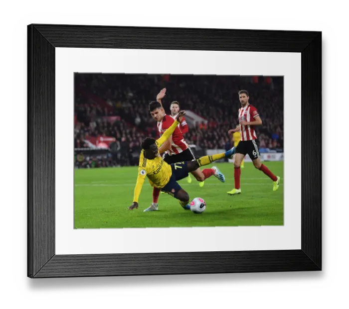 Framed Print : Saka vs Egan: Intense Battle at Bramall Lane - Sheffield United vs Arsenal, Premier League 2019-20 Framed Print : Saka vs Egan: Intense Battle at Bramall Lane - Sheffield United vs Arsenal, Premier League 2019-20