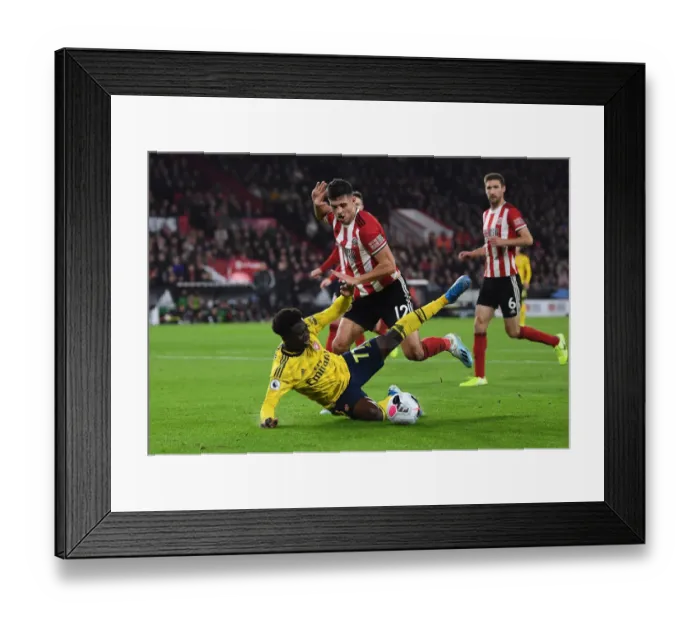 Framed Print : Saka vs Egan: A Premier League Battle at Bramall Lane - Sheffield United vs Arsenal