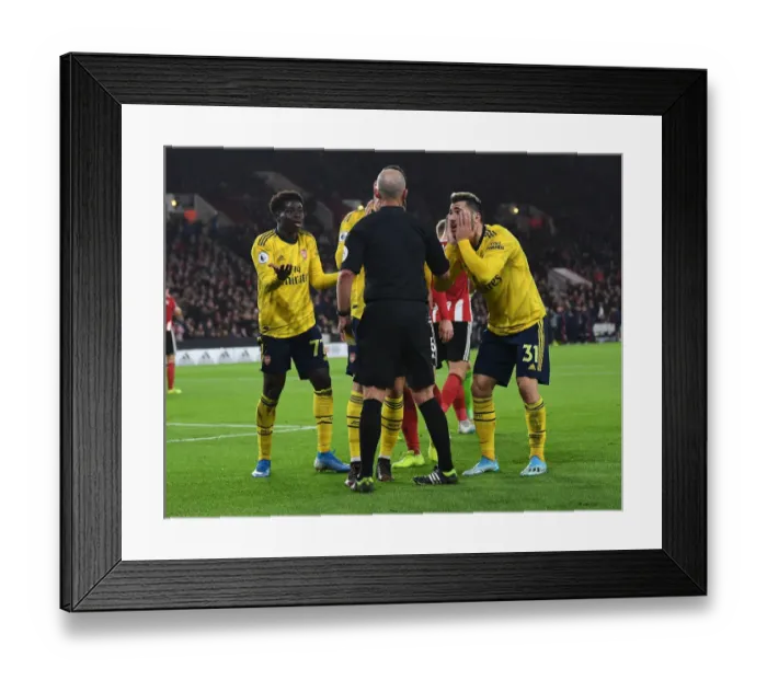 Framed Print : Arsenal's Reaction: Bukayo Saka and Sead Kolasinac Dispute Referee's Call at Sheffield United