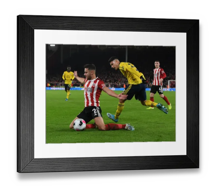 Framed Print : Martinelli vs Baldock: Clash at Bramall Lane - Sheffield United vs Arsenal, Premier League 2019-20 Framed Print : Martinelli vs Baldock: Clash at Bramall Lane - Sheffield United vs Arsenal, Premier League 2019-20