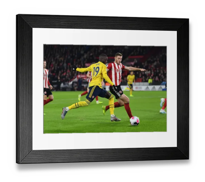 Framed Print : Pepe Under Pressure: Sheffield United vs. Arsenal, Premier League 2019-20 Framed Print : Pepe Under Pressure: Sheffield United vs. Arsenal, Premier League 2019-20