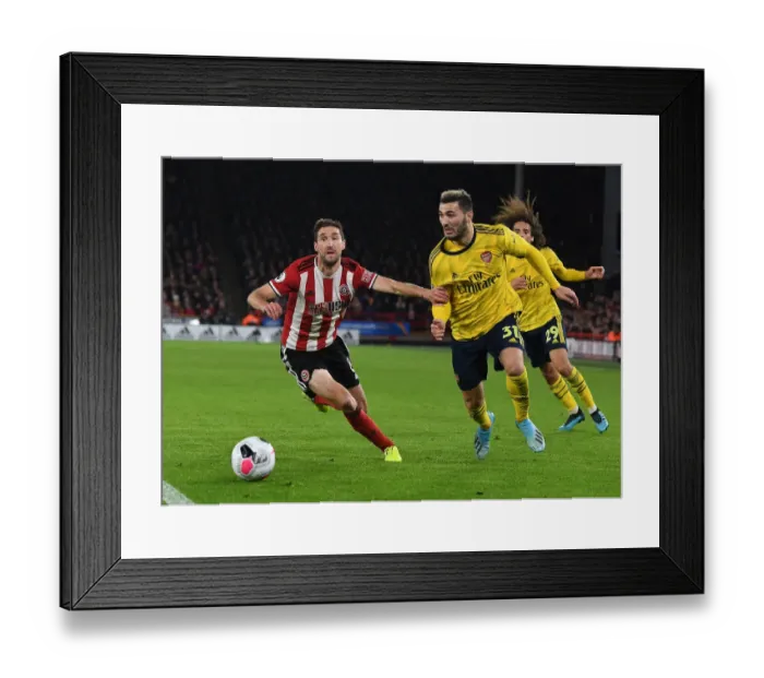 Framed Print : Arsenal vs. Sheffield United: Kolasinac vs. Basham - A Premier League Battle at Bramall Lane Framed Print : Arsenal vs. Sheffield United: Kolasinac vs. Basham - A Premier League Battle at Bramall Lane